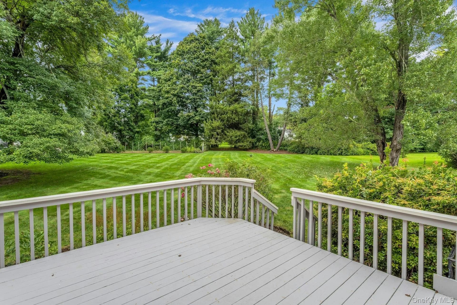 Large wood deck with steps to backyard. Large wood deck with steps to backyard.