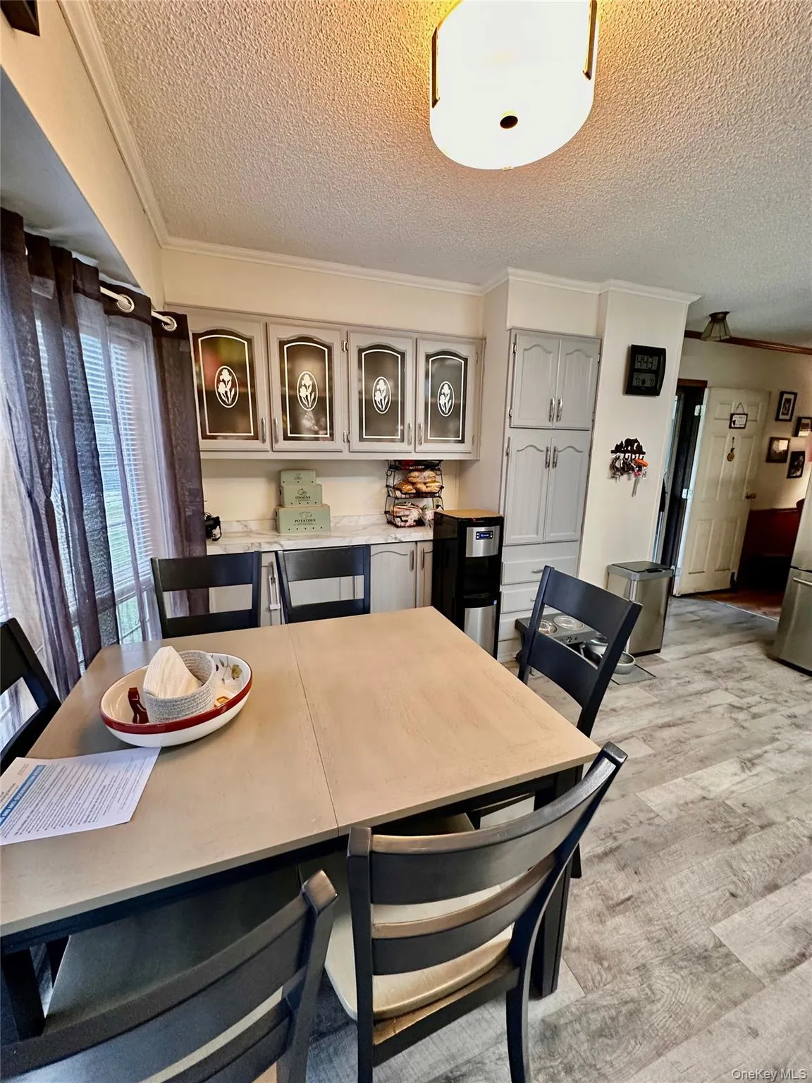 Eat-in-kitchen area with a counter and upper cabinets. Eat-in-kitchen area with a counter and upper cabinets.