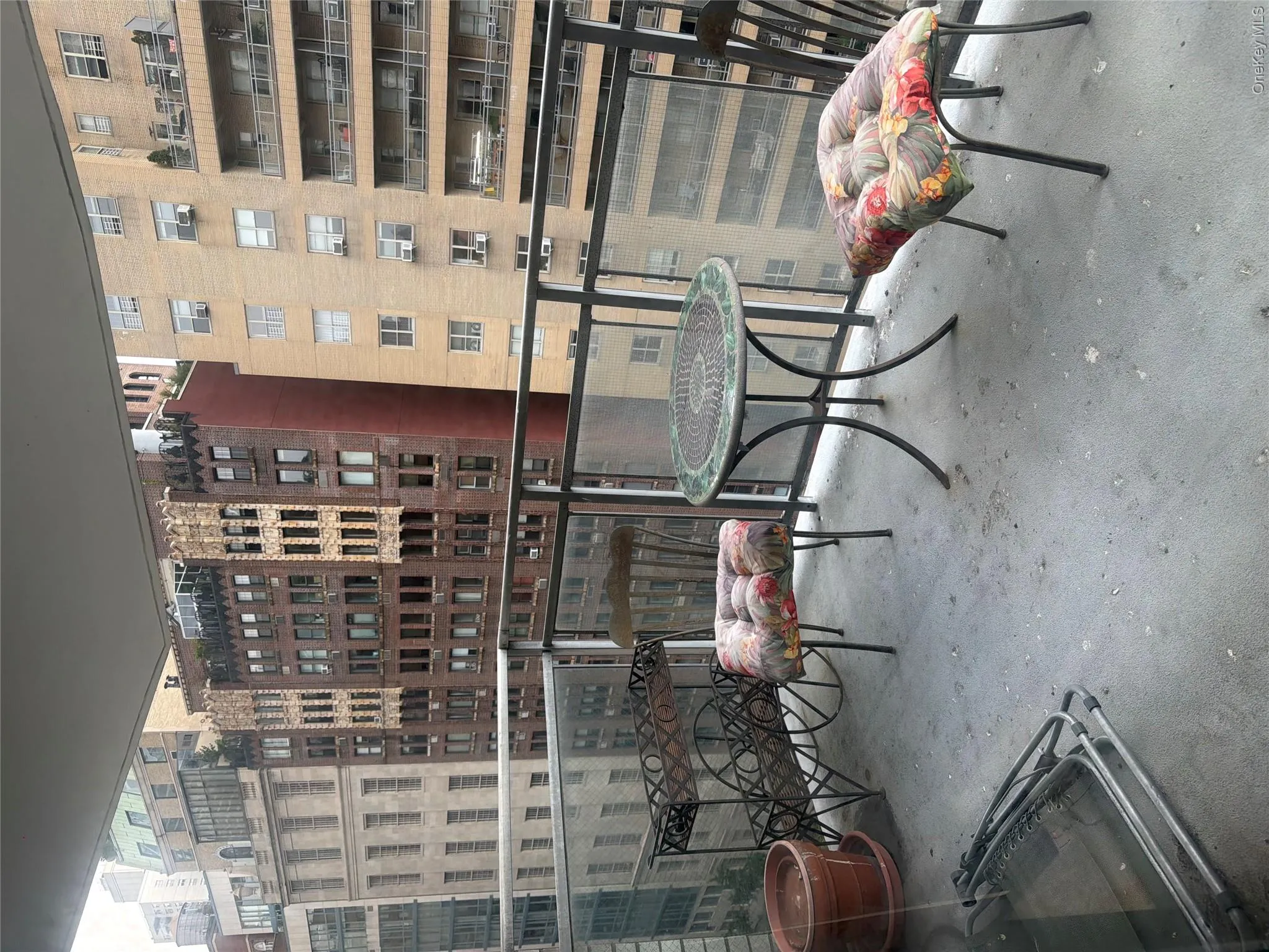 Balcony with glass panel railing and a concrete floor Balcony with glass panel railing and a concrete floor