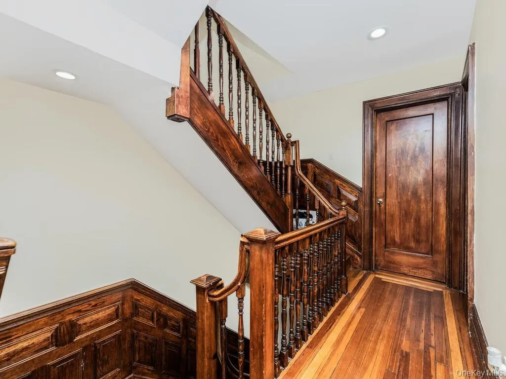 Staircase with hardwood / wood-style flooring Staircase with hardwood / wood-style flooring