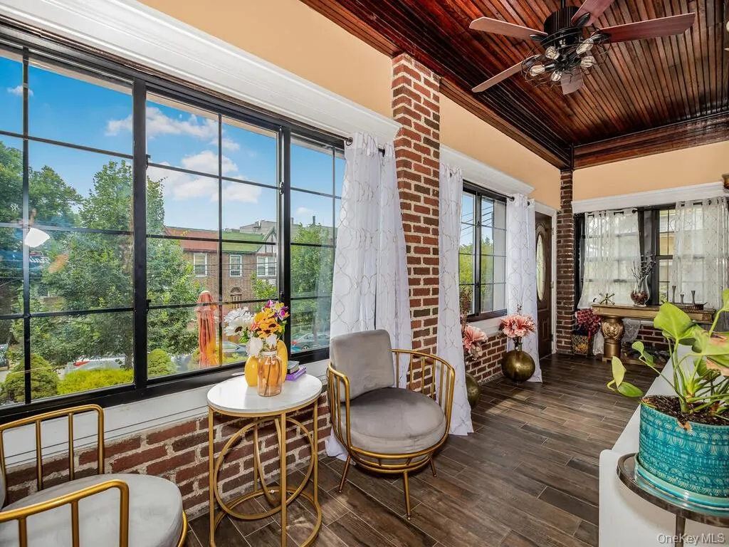 Sunroom featuring wood ceiling and ceiling fan Sunroom featuring wood ceiling and ceiling fan
