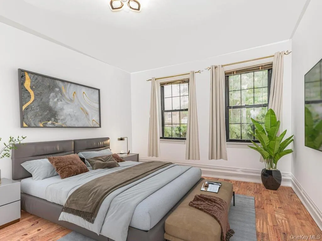 Bedroom with light hardwood / wood-style floors Bedroom with light hardwood / wood-style floors