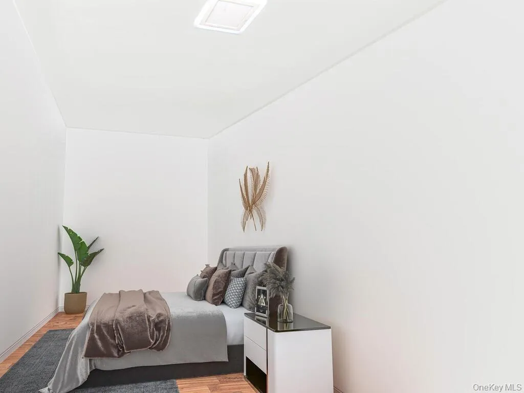 Bedroom featuring light wood-type flooring Bedroom featuring light wood-type flooring