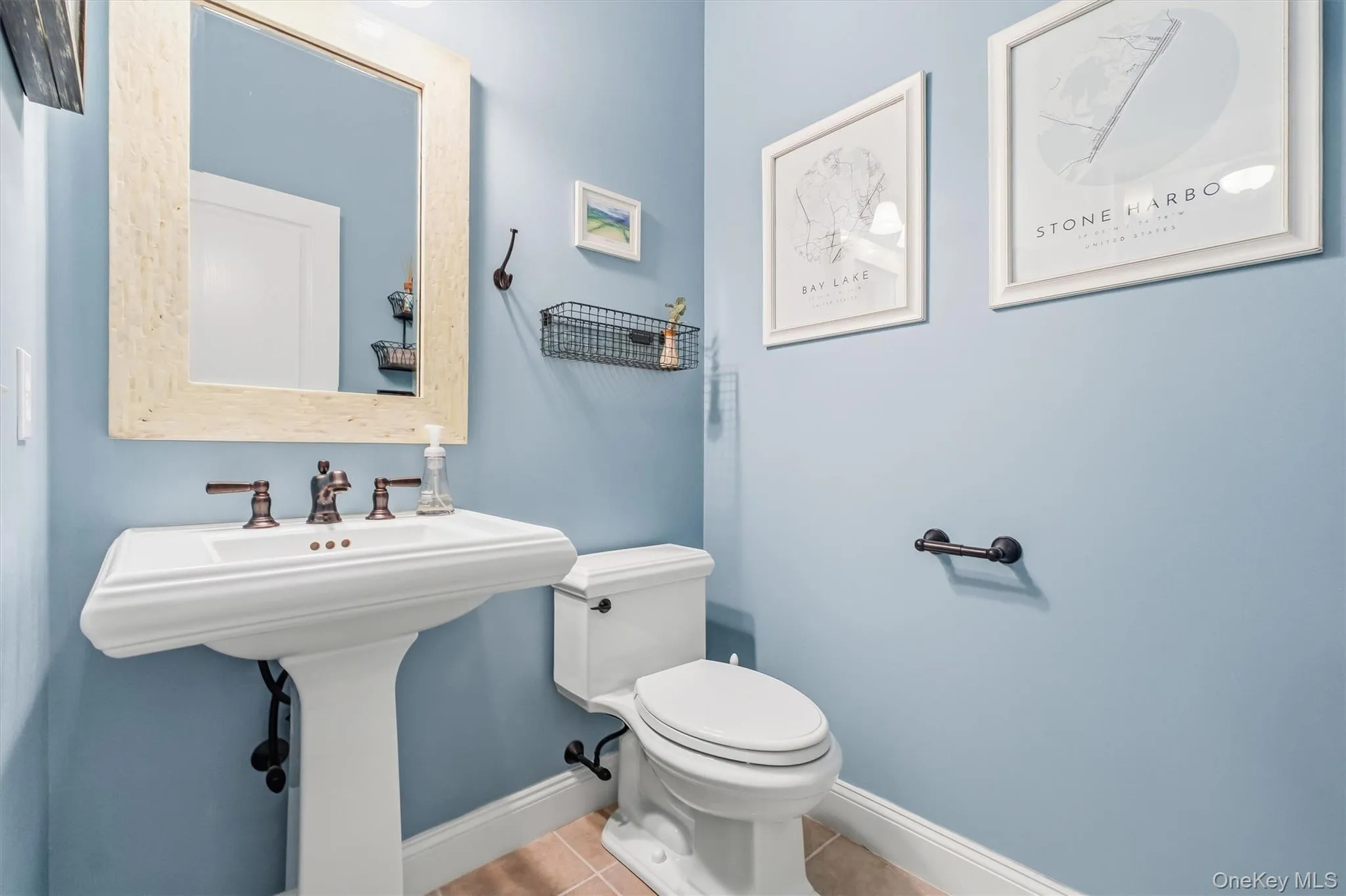 Conveniently located in the hallway between the office and family room, this generously sized powder room offers a polished blend of style and practicality. A new pedestal sink and toilet paired beautifully with the soft, neutral paint, creating a fresh and welcoming space for guests and everyday use. Conveniently located in the hallway between the office and family room, this generously sized powder room offers a polished blend of style and practicality. A new pedestal sink and toilet paired beautifully with the soft, neutral paint, creating a fresh and welcoming space for guests and everyday use.