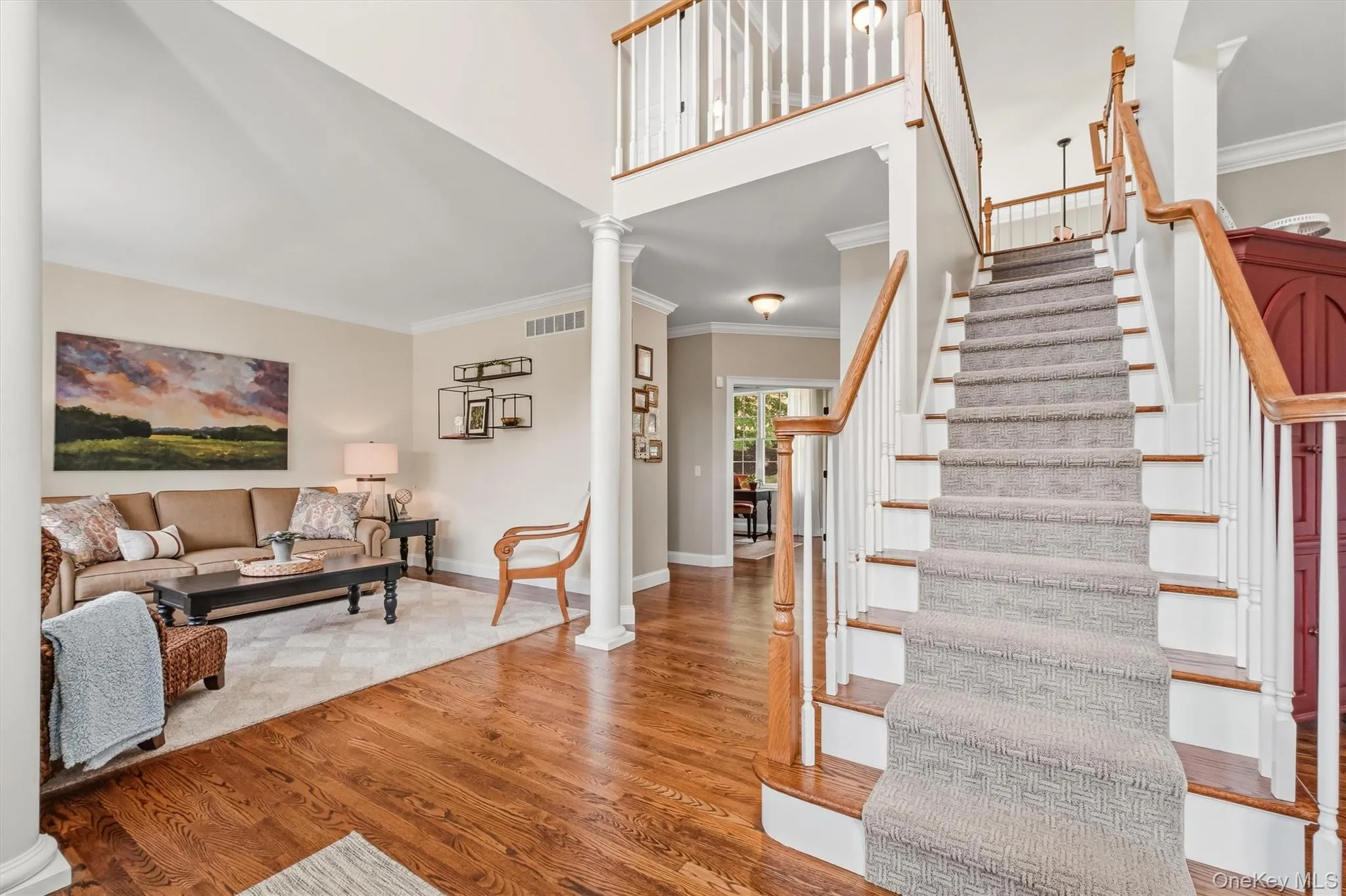 Step into the grand entryway of this exquisite contemporary Colonial and immediately feel the elegance and craftsmanship that defines over 4,400 square feet of graceful & luxurious living. This light-filled two-story foyer showcases the unique two-way staircase adorned with a classic patterned runner pairs beautifully with the gleaming pristine hardwood floors. Seamlessly connecting to multiple living areas, this impressive entry has layout that invites effortless flow throughout the first floor. From the moment you arrive, this home makes a bold statement of quality, style, and comfort. Step into the grand entryway of this exquisite contemporary Colonial and immediately feel the elegance and craftsmanship that defines over 4,400 square feet of graceful & luxurious living. This light-filled two-story foyer showcases the unique two-way staircase adorned with a classic patterned runner pairs beautifully with the gleaming pristine hardwood floors. Seamlessly connecting to multiple living areas, this impressive entry has layout that invites effortless flow throughout the first floor. From the moment you arrive, this home makes a bold statement of quality, style, and comfort.
