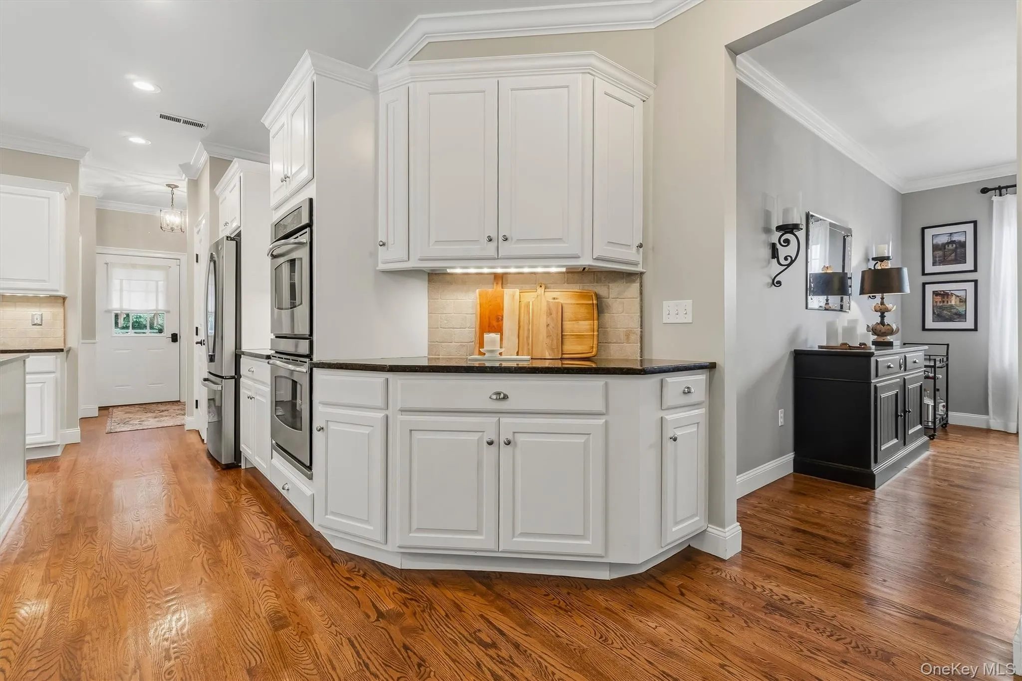 With an open layout that flows effortlessly from the kitchen and eat-in area, and dining room, it is finished with hardwood floors and elegant details, this space is an entertainer’s dream both stylish and functional. With an open layout that flows effortlessly from the kitchen and eat-in area, and dining room, it is finished with hardwood floors and elegant details, this space is an entertainer’s dream both stylish and functional.