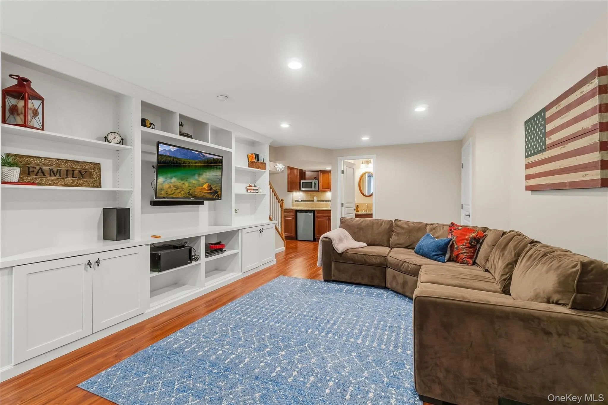 The expansive layout continues with a generously sized living and media area, creating an inviting setting for memorable movie nights and relaxed gatherings. The expansive layout continues with a generously sized living and media area, creating an inviting setting for memorable movie nights and relaxed gatherings.