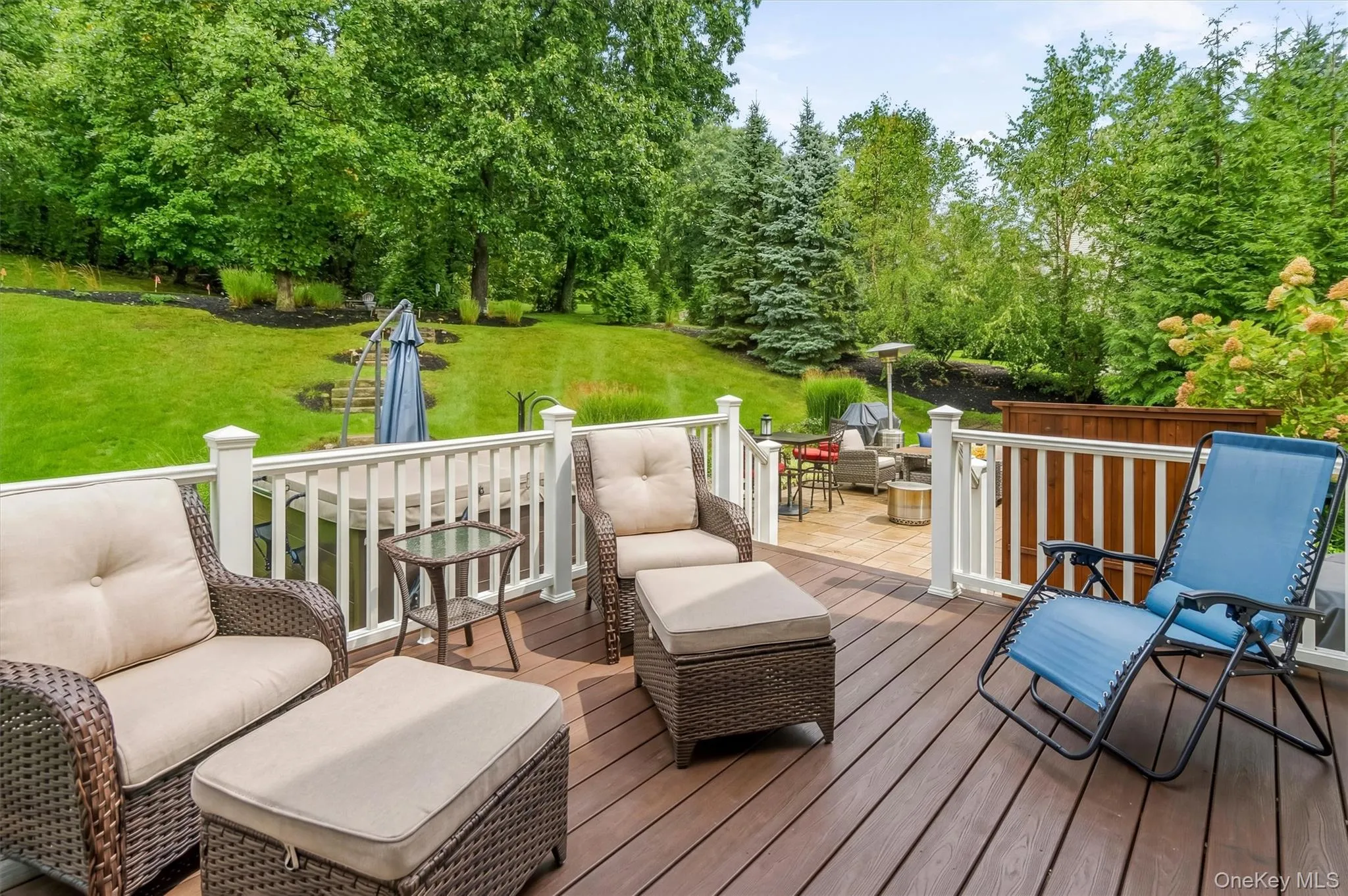 Perched atop the prestigious Legends neighborhood, this updated Trex deck with motorized retractable awning offers majestic, private rear views that create your own personal retreat. Whether you're entertaining guests or simply unwinding after a long day, this is truly Nature’s Paradise—an idyllic setting where peace and tranquility surround you. You’ll feel like you’ve escaped to the Adirondacks while enjoying all the comforts of this beautifully designed contemporary colonial in the heart of the Hudson Valley. Perched atop the prestigious Legends neighborhood, this updated Trex deck with motorized retractable awning offers majestic, private rear views that create your own personal retreat. Whether you're entertaining guests or simply unwinding after a long day, this is truly Nature’s Paradise—an idyllic setting where peace and tranquility surround you. You’ll feel like you’ve escaped to the Adirondacks while enjoying all the comforts of this beautifully designed contemporary colonial in the heart of the Hudson Valley.