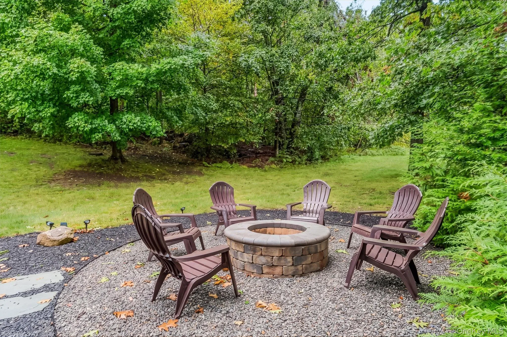 Tier 2 yard Firepit:A private putting green adds a playful resort-style touch, while the versatile layout provides the perfect backdrop for practicing your short game by day and toasting marshmallows under the stars at night—all with minimal upkeep and exceptional privacy. Tier 2 yard Firepit:A private putting green adds a playful resort-style touch, while the versatile layout provides the perfect backdrop for practicing your short game by day and toasting marshmallows under the stars at night—all with minimal upkeep and exceptional privacy.