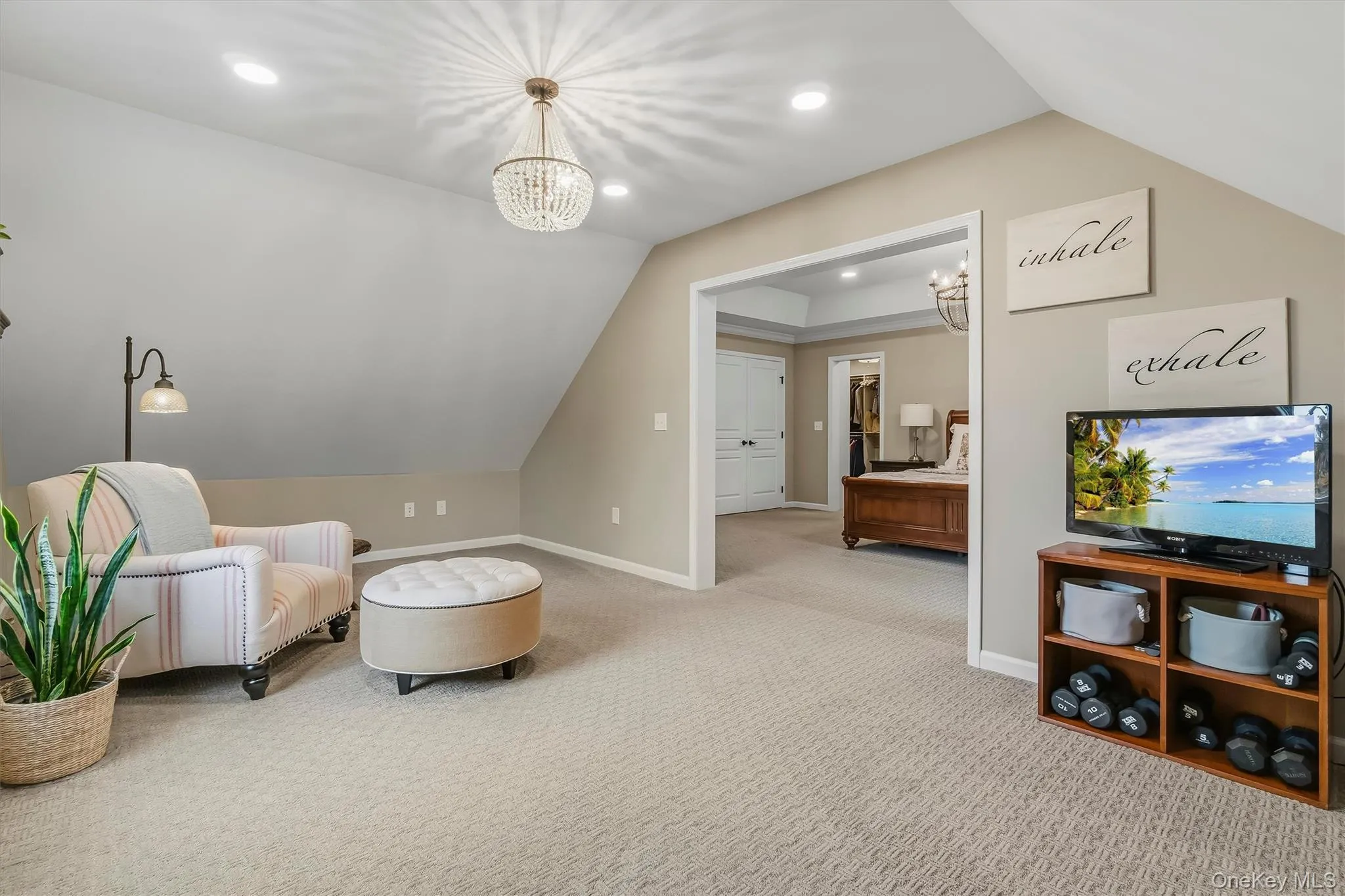 Added in 2019, this attached sitting room is a seamless extension of the primary suite, offering a private and versatile retreat filled with natural light. Generously sized, the space can serve as a cozy reading nook, a private media lounge, or additional wardrobe and dressing space. Whether enjoying a favorite book, watching television, or simply unwinding, this flexible room enhances the suite with added comfort and functionality Added in 2019, this attached sitting room is a seamless extension of the primary suite, offering a private and versatile retreat filled with natural light. Generously sized, the space can serve as a cozy reading nook, a private media lounge, or additional wardrobe and dressing space. Whether enjoying a favorite book, watching television, or simply unwinding, this flexible room enhances the suite with added comfort and functionality
