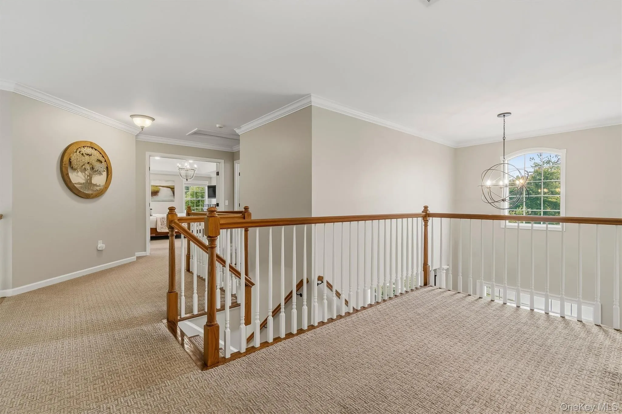Spanning the upper level above both the dramatic two-story family room and grand front foyer, this open catwalk offers striking views from each side and adds impressive architectural character to the home. Accessed by the distinctive two-way staircase, it serves as a graceful central connection between the private primary suite and bath, three additional bedrooms, and a full hall bathroom. Spanning the upper level above both the dramatic two-story family room and grand front foyer, this open catwalk offers striking views from each side and adds impressive architectural character to the home. Accessed by the distinctive two-way staircase, it serves as a graceful central connection between the private primary suite and bath, three additional bedrooms, and a full hall bathroom.