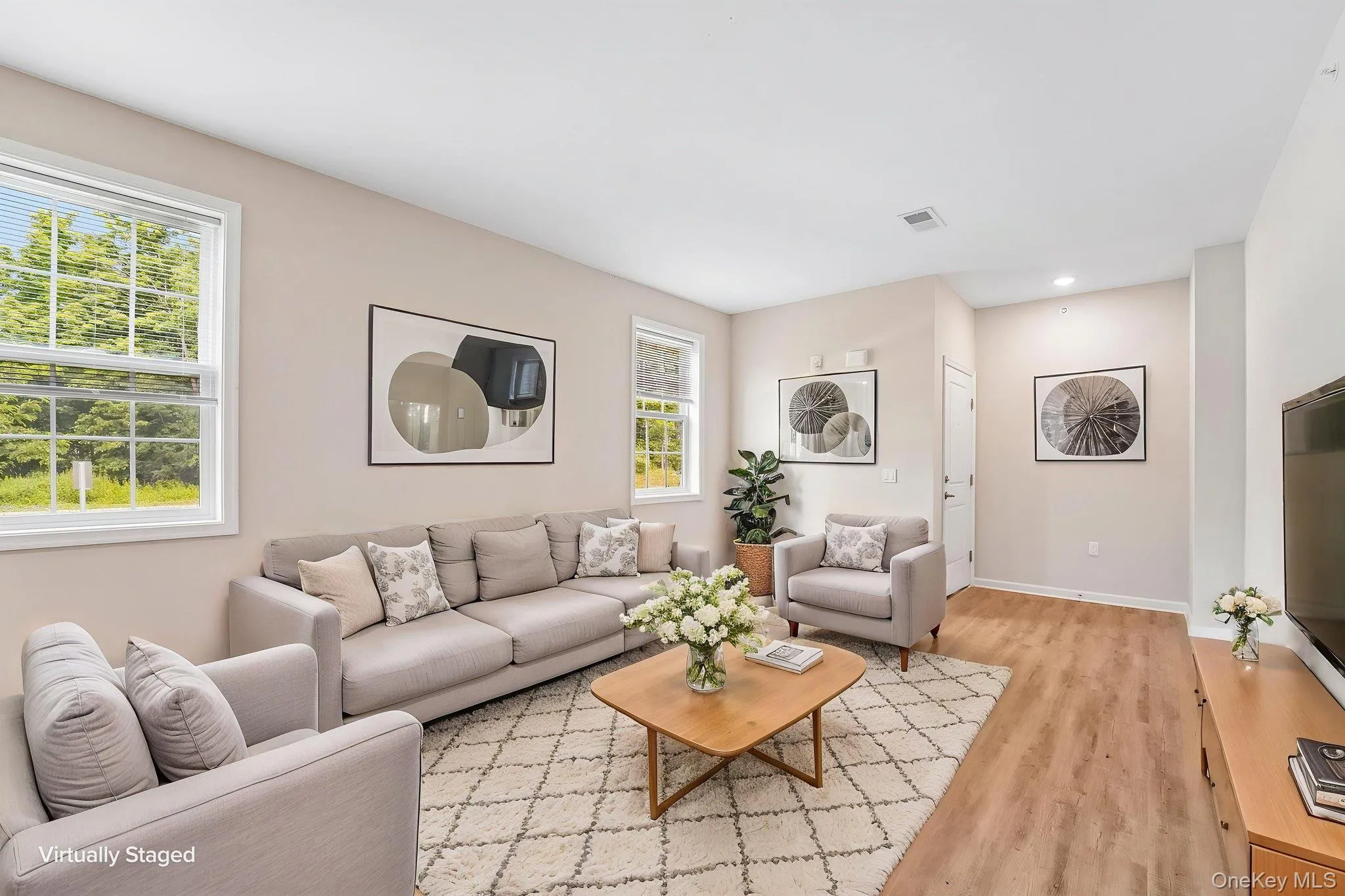 Recessed lighting, light wood-finish flooring, and white trim Recessed lighting, light wood-finish flooring, and white trim
