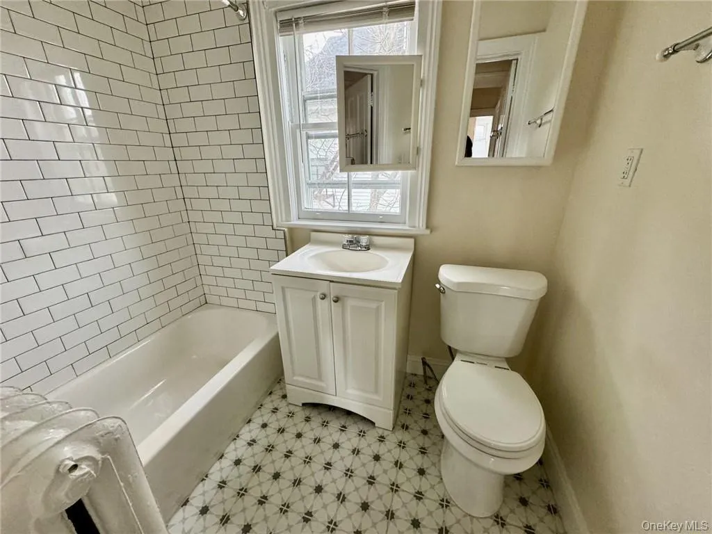 Full bathroom with shower and bathtub Full bathroom with shower and bathtub