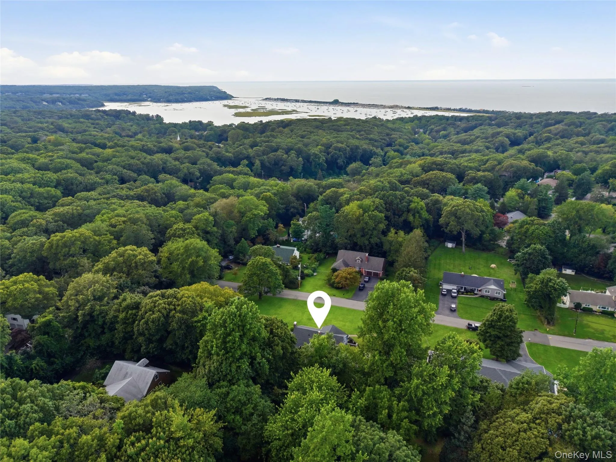Expansive treed landscape with Mount Sinai harbor and the Long Island Sound in the background Expansive treed landscape with Mount Sinai harbor and the Long Island Sound in the background