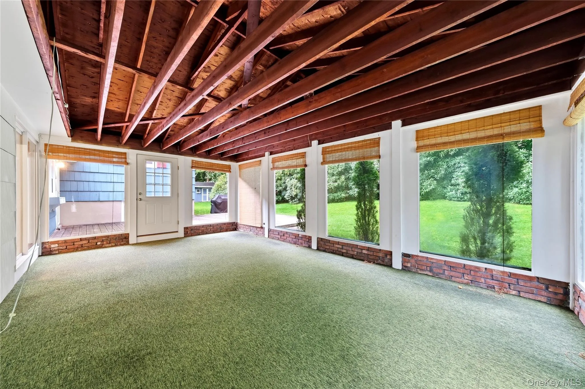Florida room off of kitchen with vaulted ceiling Florida room off of kitchen with vaulted ceiling