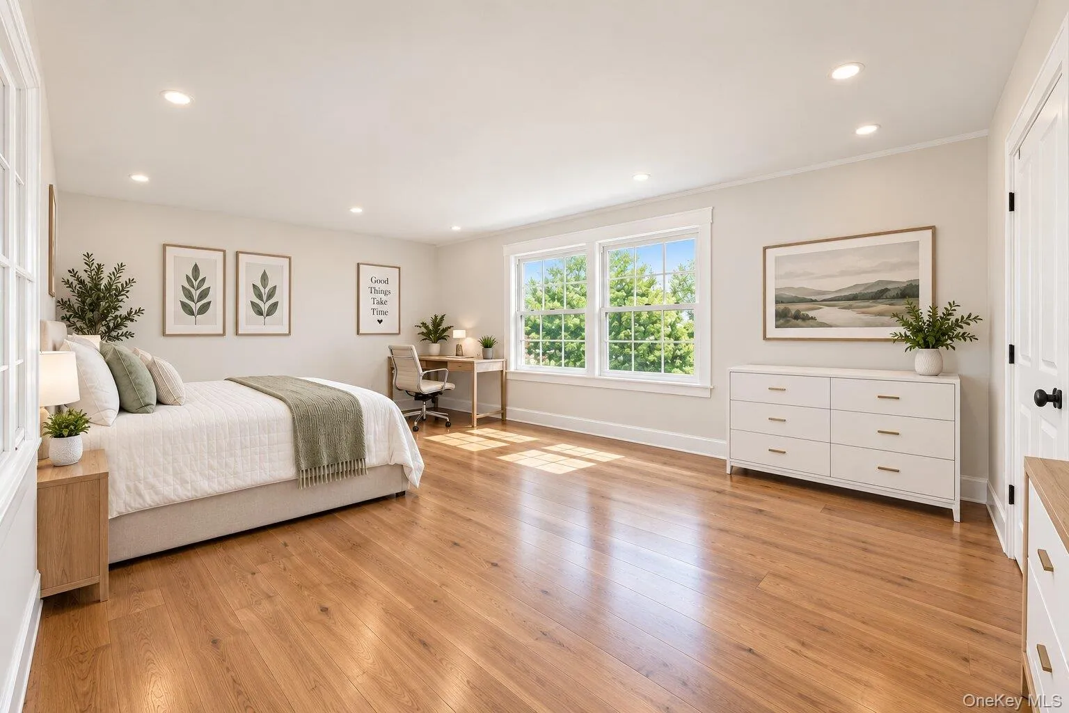Hardwood flooring, recessed lighting, large windows, crown molding, and a paneled door Hardwood flooring, recessed lighting, large windows, crown molding, and a paneled door