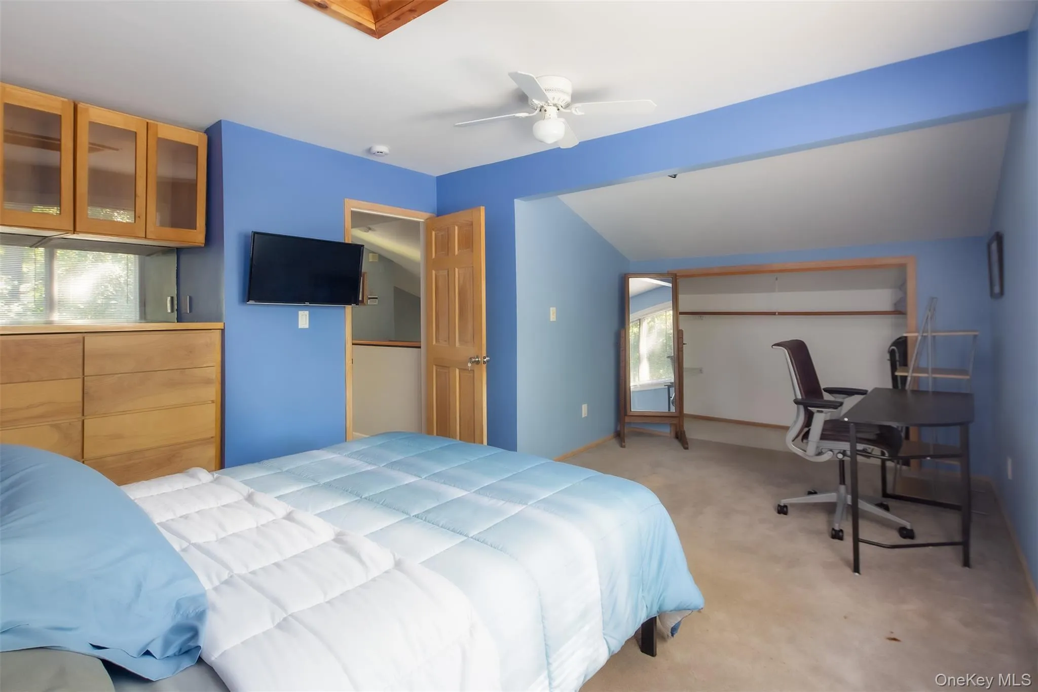 Large room with carpeting. On second floor Large room with carpeting. On second floor
