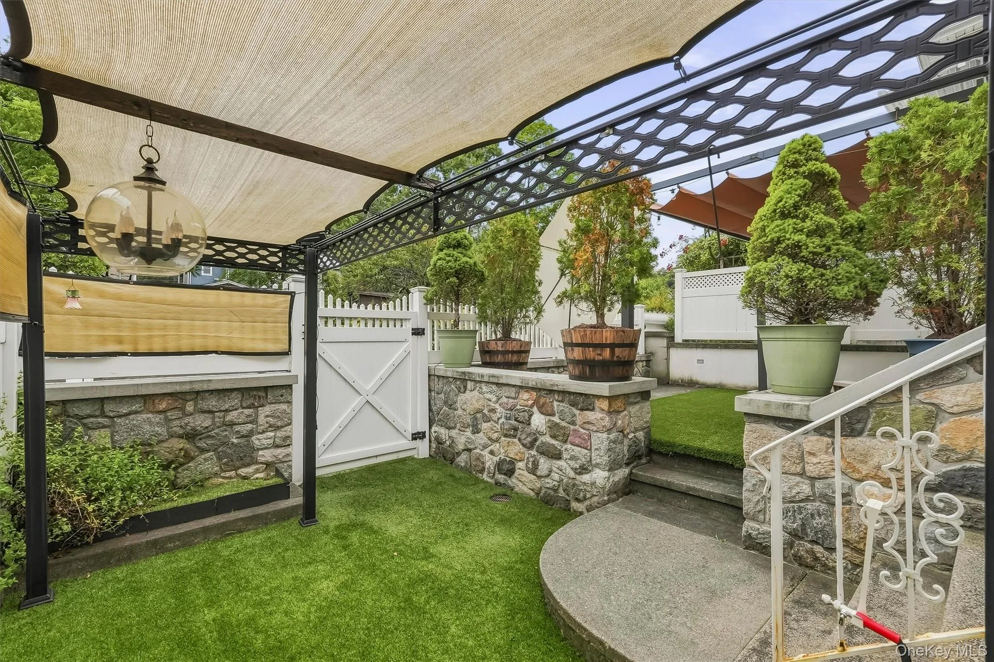 Your private, multi-level backyard oasis. Stone walls, custom steps and privacy fencing makes for a perfect area to enjoy the outdoors. Your private, multi-level backyard oasis. Stone walls, custom steps and privacy fencing makes for a perfect area to enjoy the outdoors.