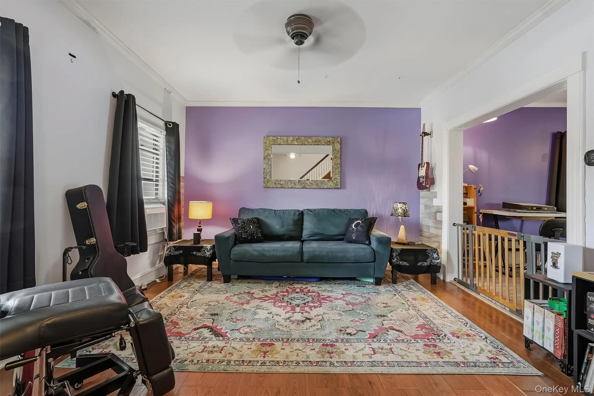 Spacious living room with laminate flooring leads to the formal dining room. Spacious living room with laminate flooring leads to the formal dining room.