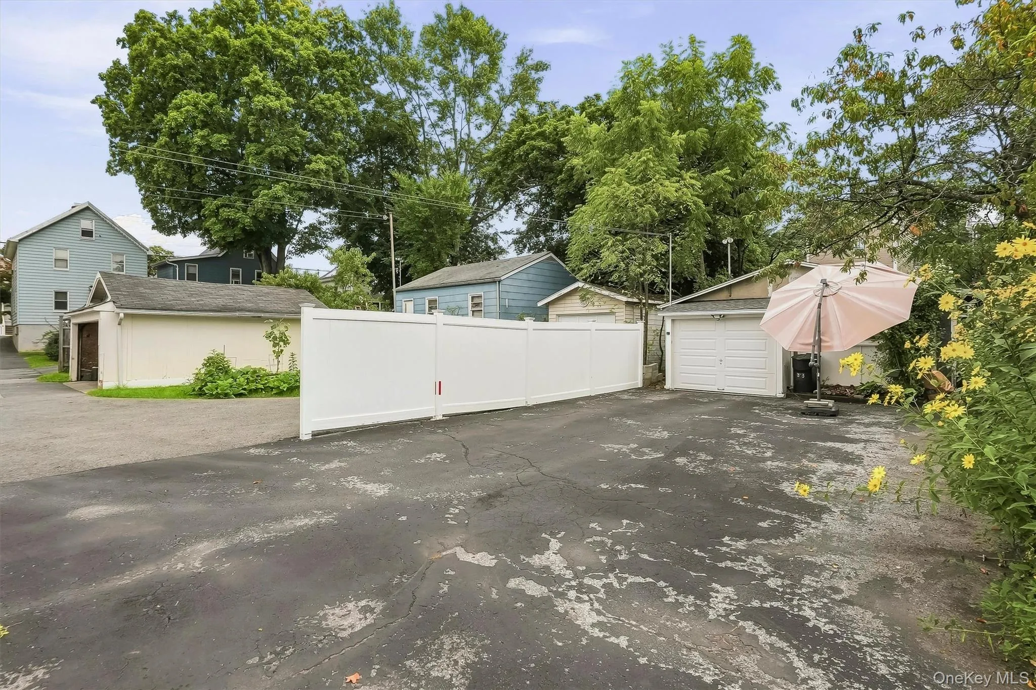 The one car garage, driveway and additional outdoor space are accessed from behind the home through a right of way. The one car garage, driveway and additional outdoor space are accessed from behind the home through a right of way.