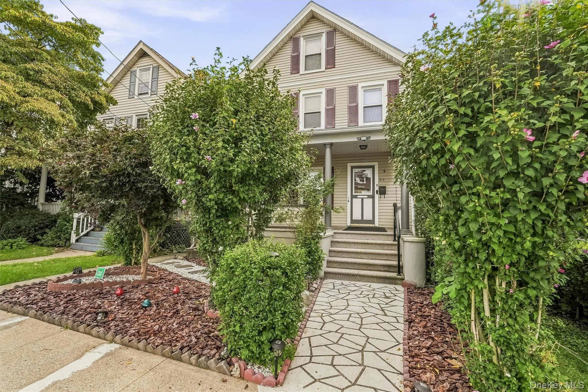 Custom walkway, mature landscaping and front porch give this one incredible curb appeal. Custom walkway, mature landscaping and front porch give this one incredible curb appeal.