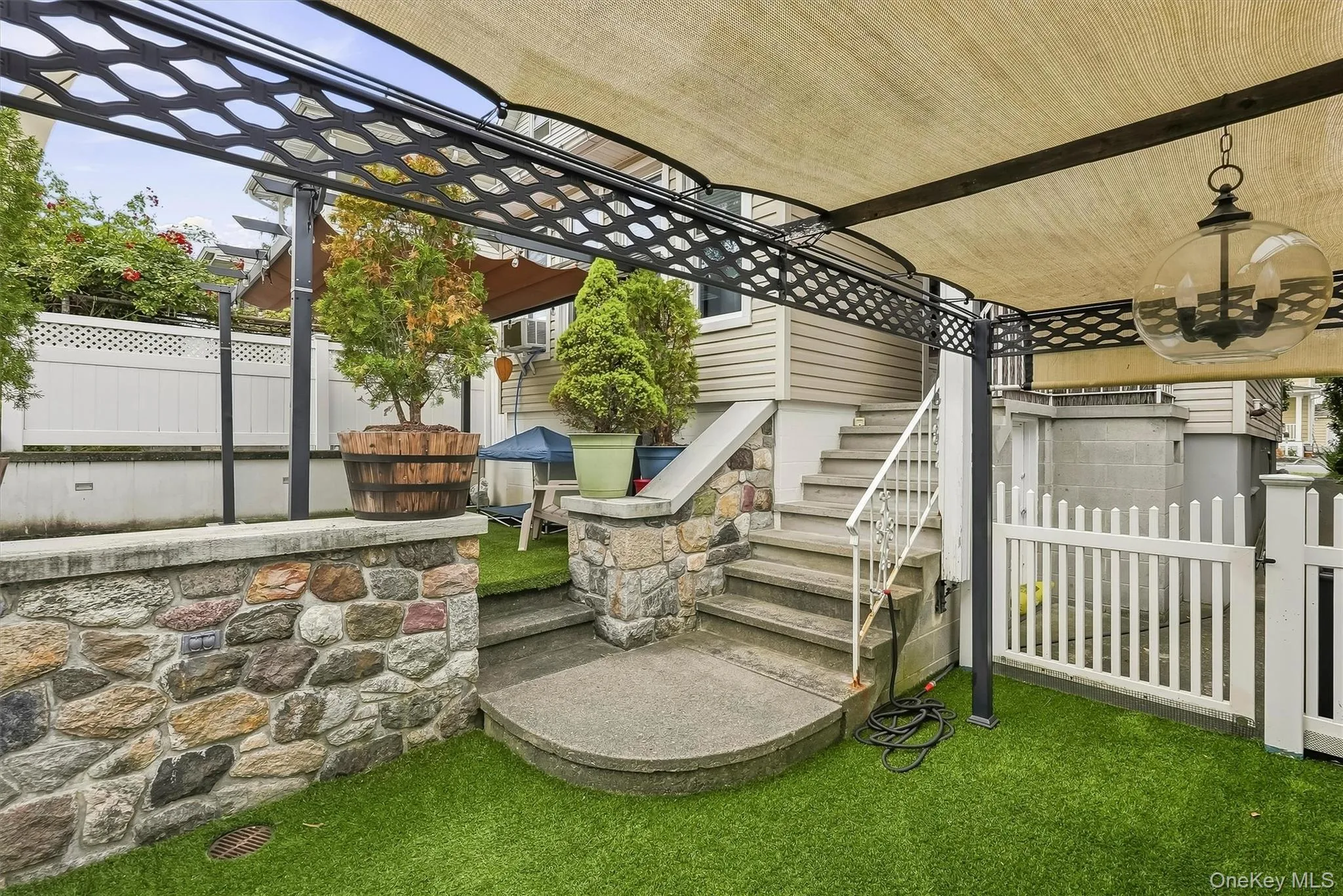 Just a few steps from the kitchen and completely fenced in. Also small storage for outdoor items under the steps. Just a few steps from the kitchen and completely fenced in. Also small storage for outdoor items under the steps.