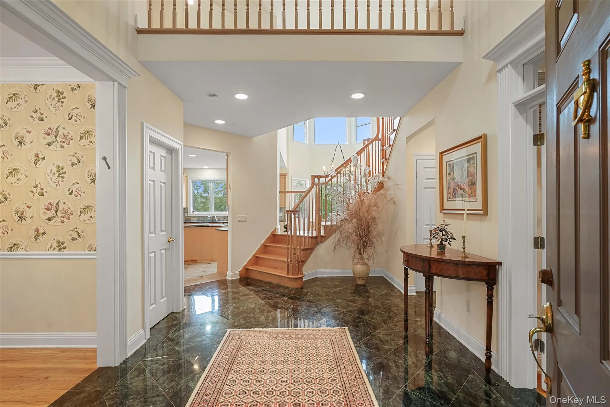 2-story entrance foyer with unique open staircase leading to the bridge upstairs connecting the bedrooms 2-story entrance foyer with unique open staircase leading to the bridge upstairs connecting the bedrooms