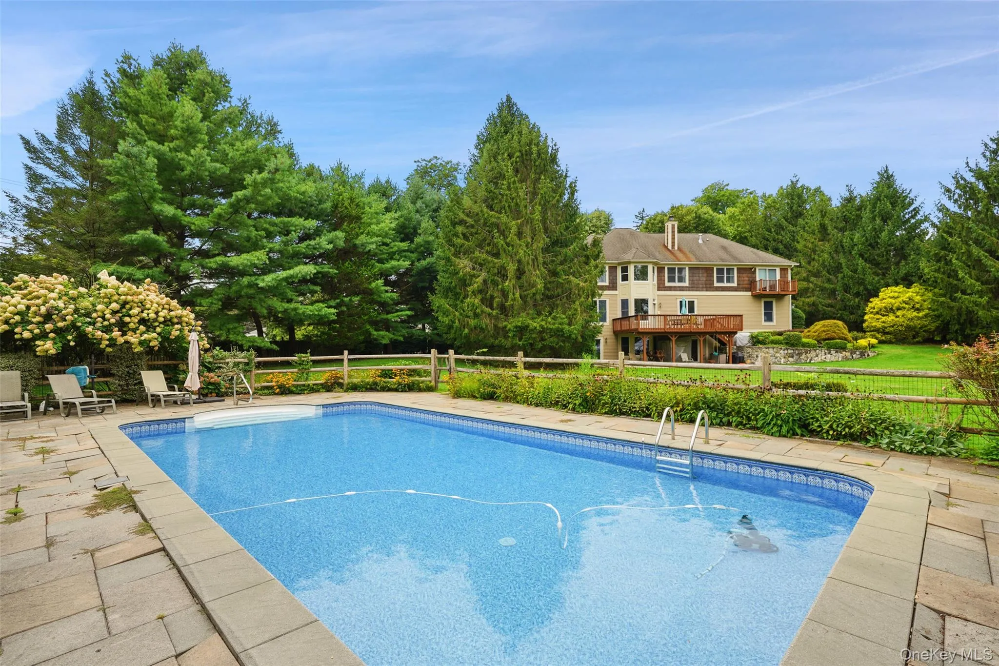 Gorgeous in-ground pool with flowering gardens Gorgeous in-ground pool with flowering gardens