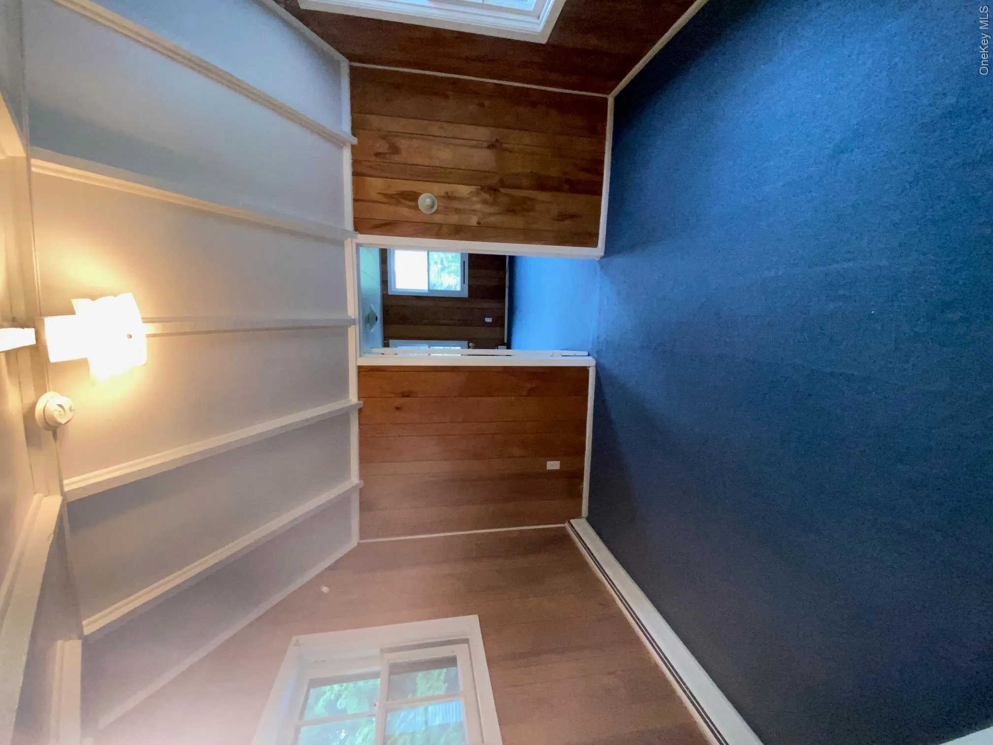 The living room has vaulted ceilings and lots of natural sunlight. VIew is from kitchen The living room has vaulted ceilings and lots of natural sunlight. VIew is from kitchen