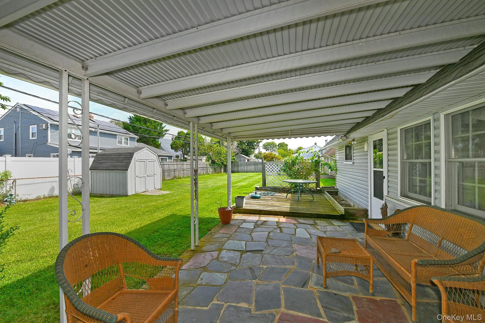 Covered patio featuring flagstone flooring Covered patio featuring flagstone flooring