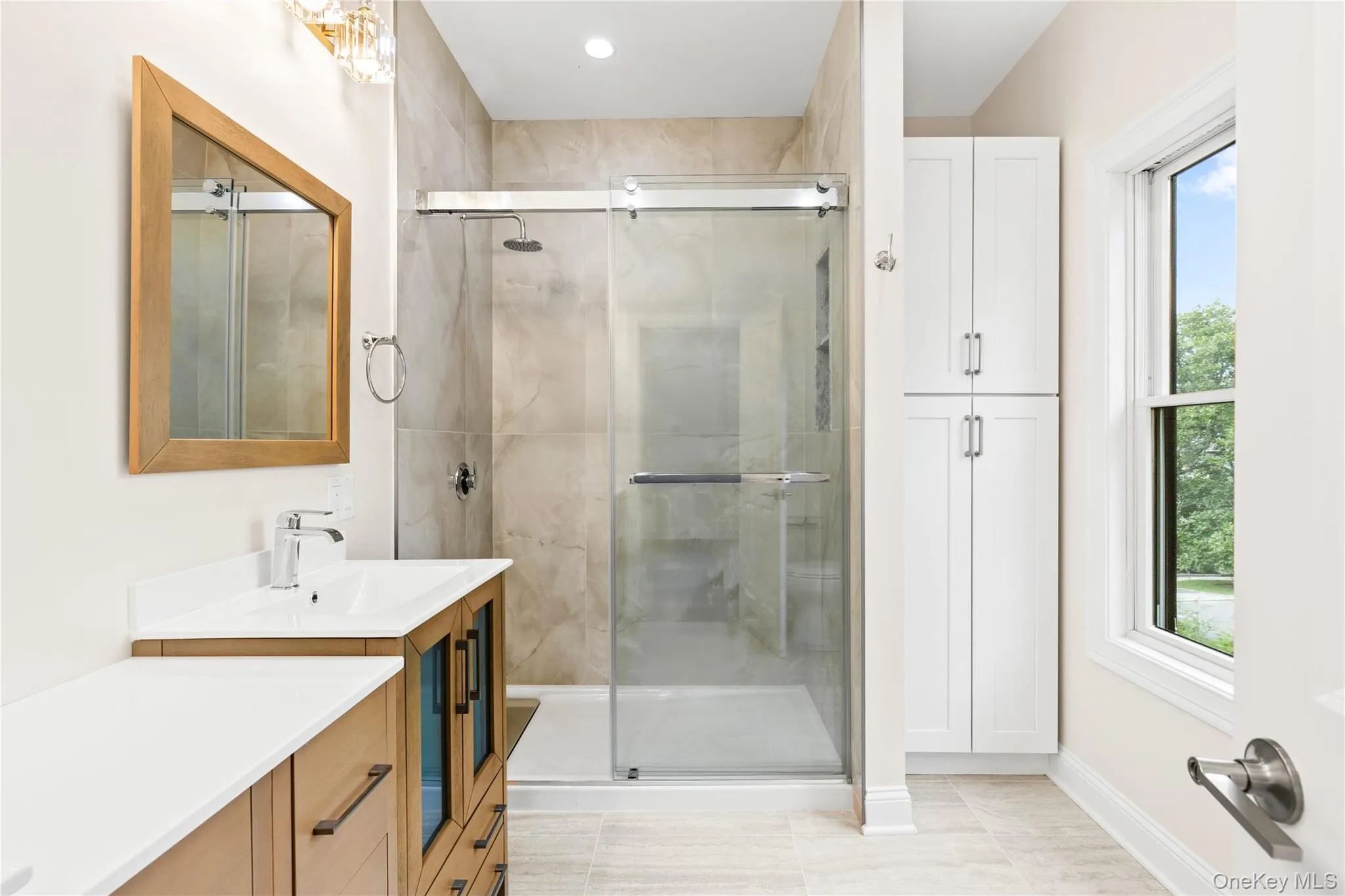 The Primary Bathroom is well-appointed with a shower stall, double vanity and a linen/medicine closet. The Primary Bathroom is well-appointed with a shower stall, double vanity and a linen/medicine closet.