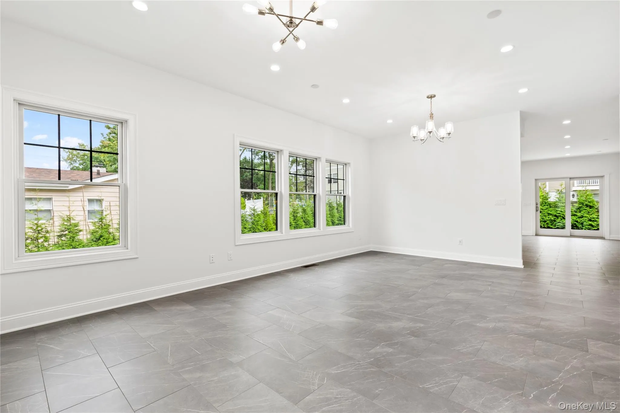 Living Room/Dining Room with large, double paned windows for maximum natural light. Living Room/Dining Room with large, double paned windows for maximum natural light.