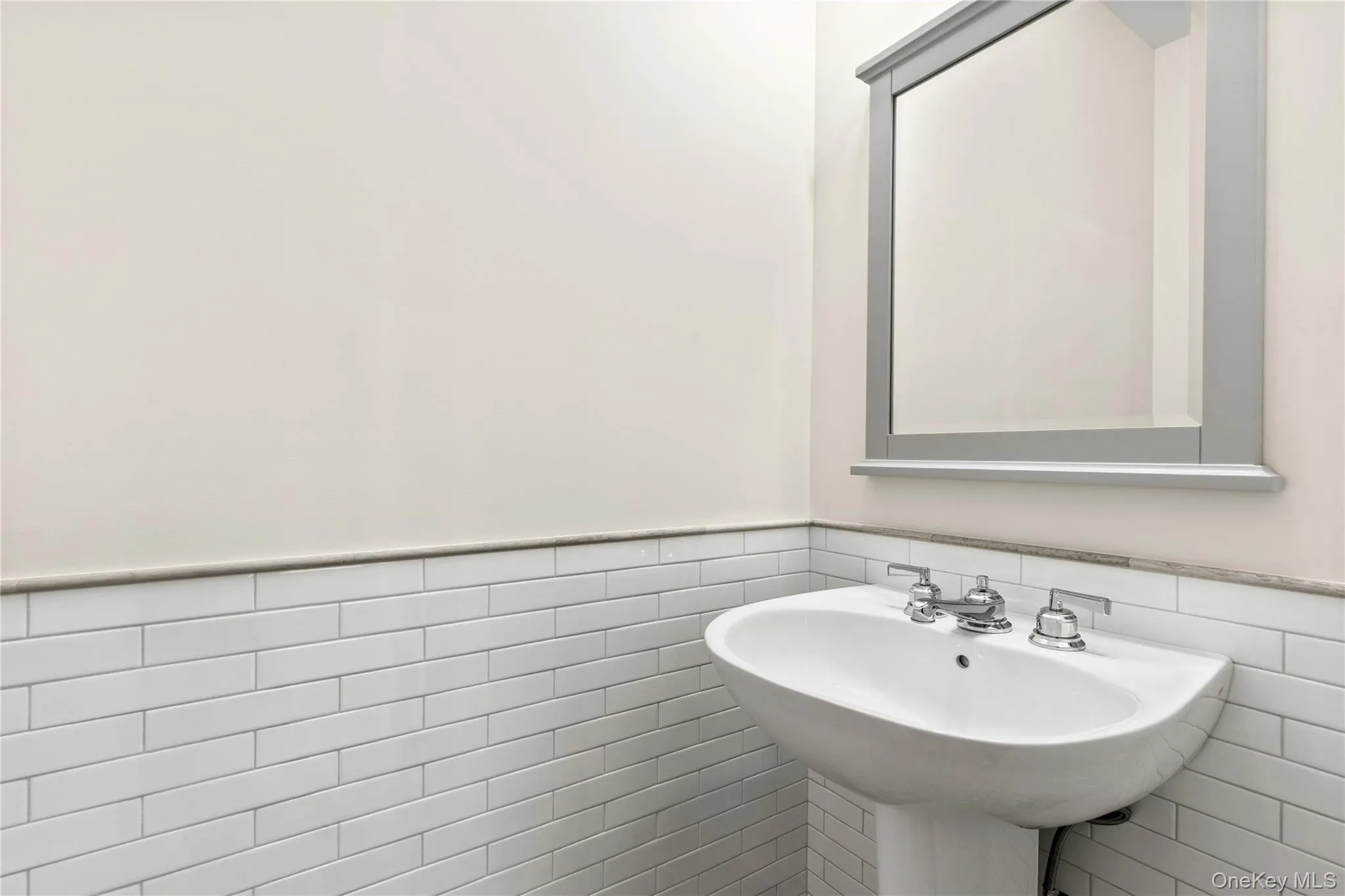 An elegant Powder Room is discreetly situated between the Living Room/Dining Room and the Kitchen/Family Room. An elegant Powder Room is discreetly situated between the Living Room/Dining Room and the Kitchen/Family Room.