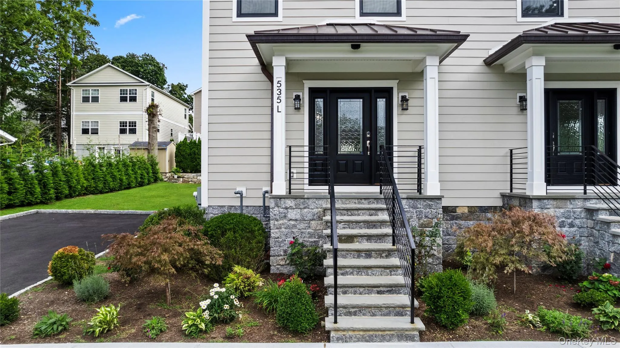 Welcoming and stately front porch shielded from inclement weather. Welcoming and stately front porch shielded from inclement weather.