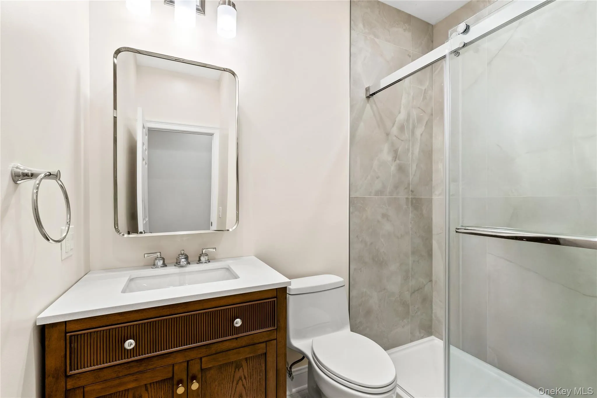 The shared Hall Bathroom is elevated and functional. The shared Hall Bathroom is elevated and functional.