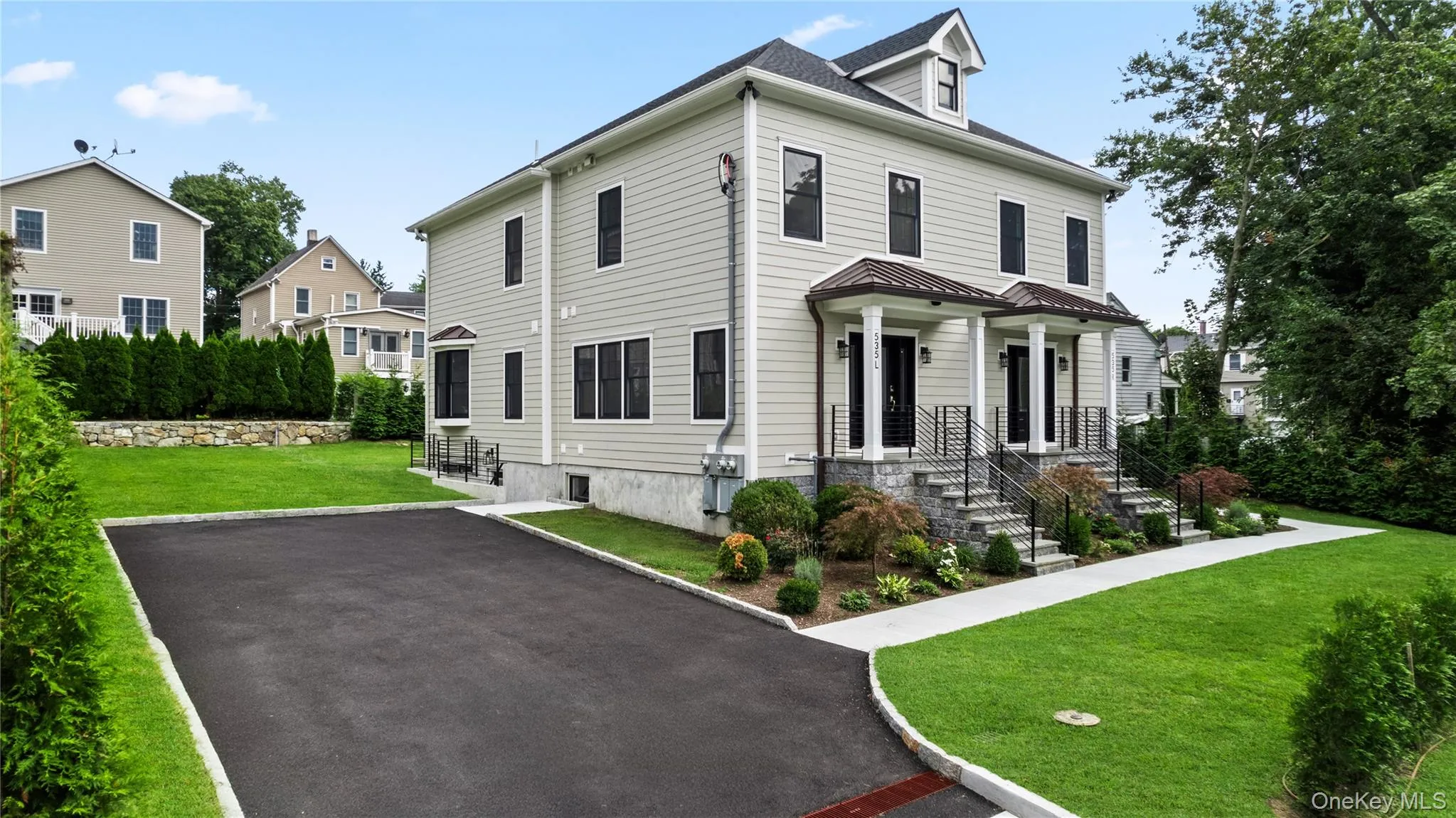 The driveway accommodates 2 vehicles for Duplex L. The driveway accommodates 2 vehicles for Duplex L.