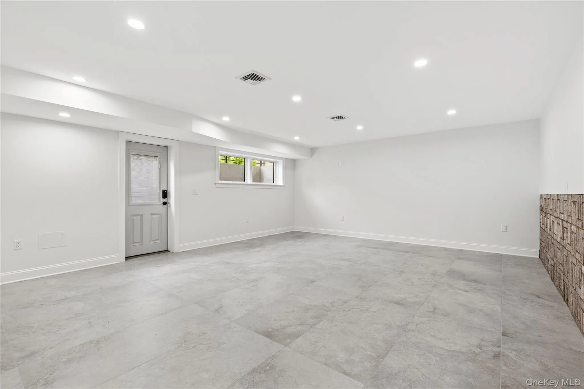 The walk-out Lower Level rec room has direct access to the exterior. The walk-out Lower Level rec room has direct access to the exterior.