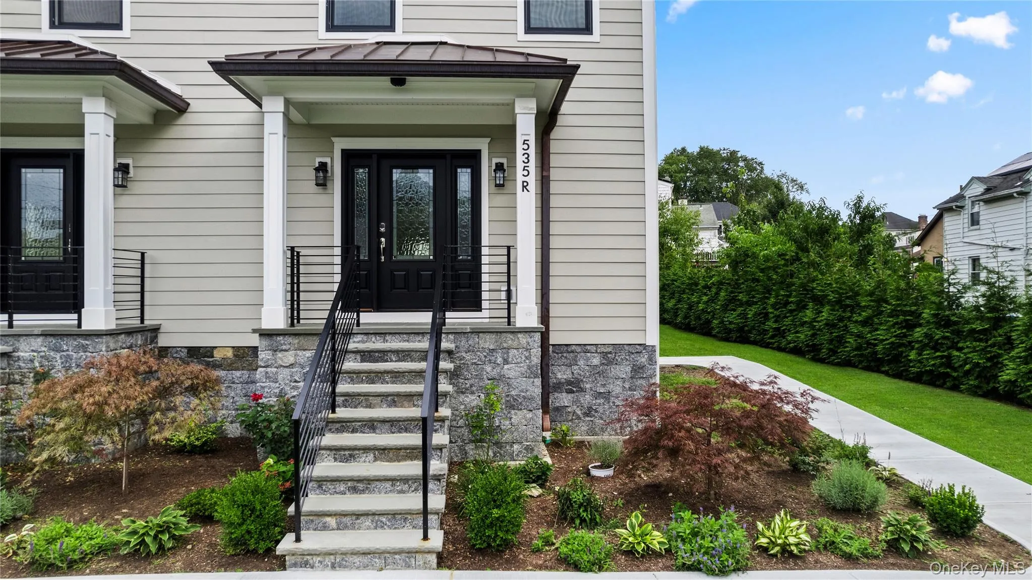 Welcoming and stately front porch shielded from inclement weather. Welcoming and stately front porch shielded from inclement weather.