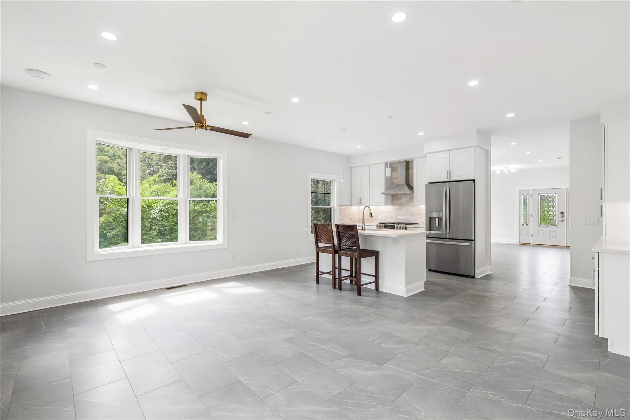 The delineating kitchen island offers at-the-counter seating for additional dining options. The delineating kitchen island offers at-the-counter seating for additional dining options.