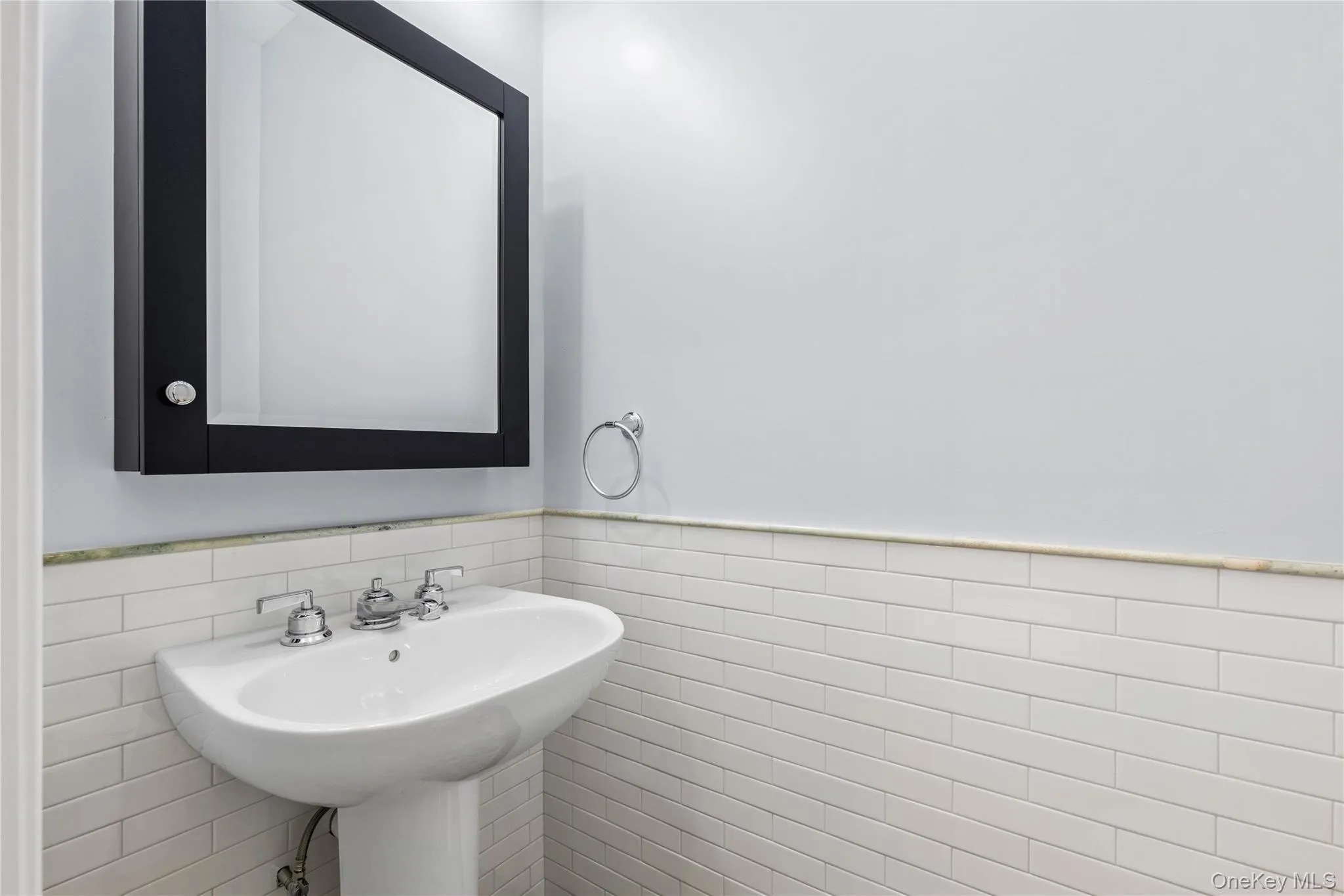 An elegant Powder Room is discreetly situated between the Living Room/Dining Room and the Kitchen/Family Room. An elegant Powder Room is discreetly situated between the Living Room/Dining Room and the Kitchen/Family Room.