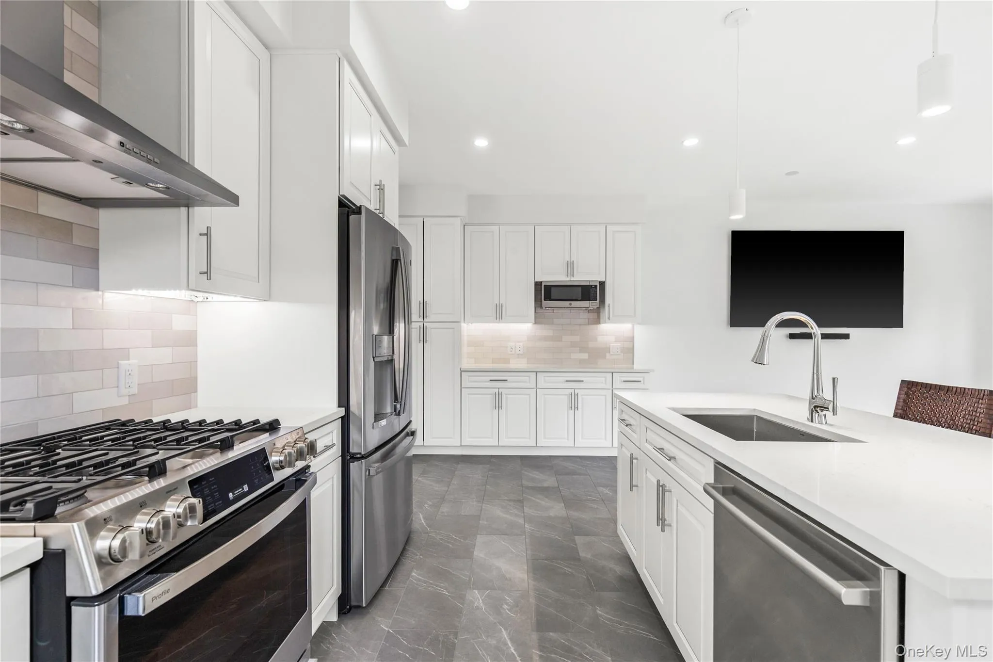 The Kitchen is sleek and modern with stainless steel appliances, lots of cabinet storage and plenty of counter space. The Kitchen is sleek and modern with stainless steel appliances, lots of cabinet storage and plenty of counter space.