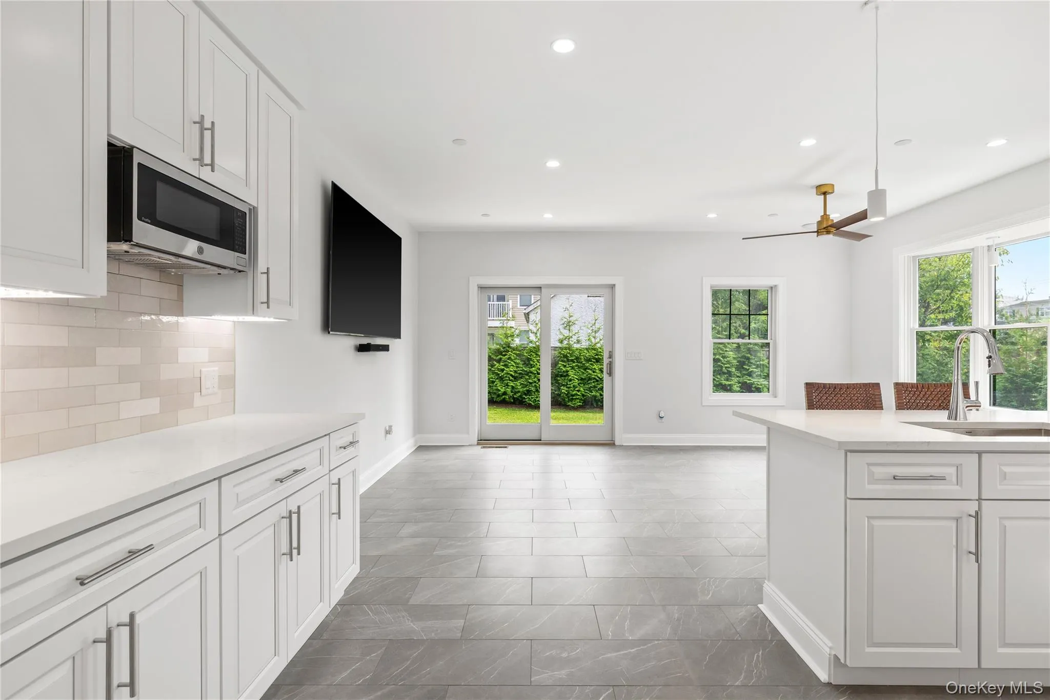 The Kitchen opens into a coveted family room. The Kitchen opens into a coveted family room.