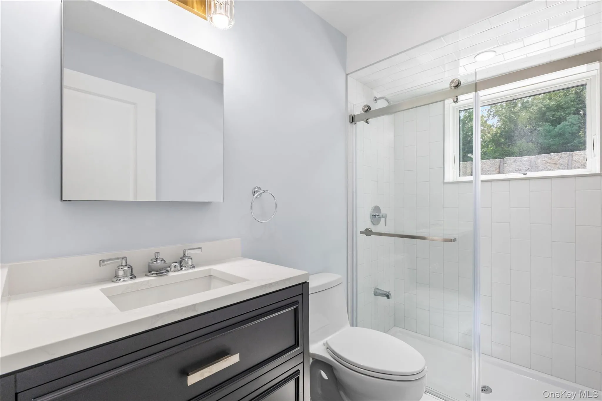 The Lower Level Bathroom enjoys natural light and stylish fixtures. The Lower Level Bathroom enjoys natural light and stylish fixtures.