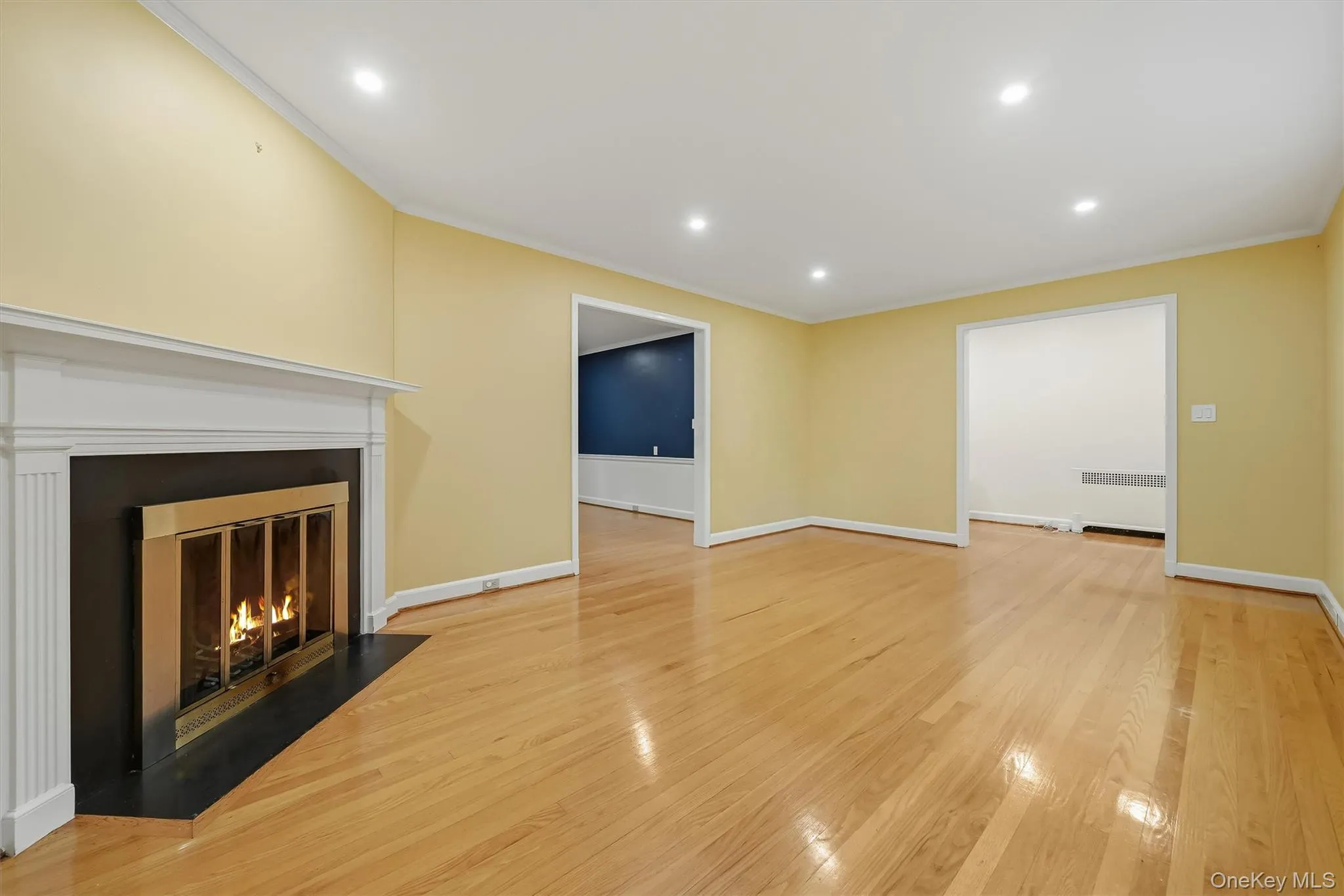 Hardwood floors, fireplace, view towards Dining Room Hardwood floors, fireplace, view towards Dining Room