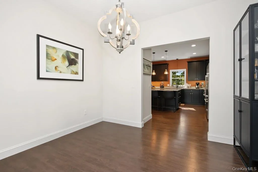 Hardwood-finish flooring, overhead chandelier. Hardwood-finish flooring, overhead chandelier.