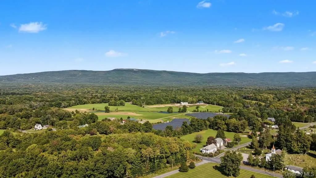 Expansive natural landscape with a prominent mountain range Expansive natural landscape with a prominent mountain range