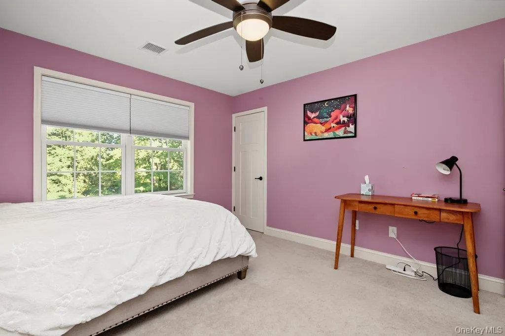 white paneled door, and neutral-toned carpeting white paneled door, and neutral-toned carpeting