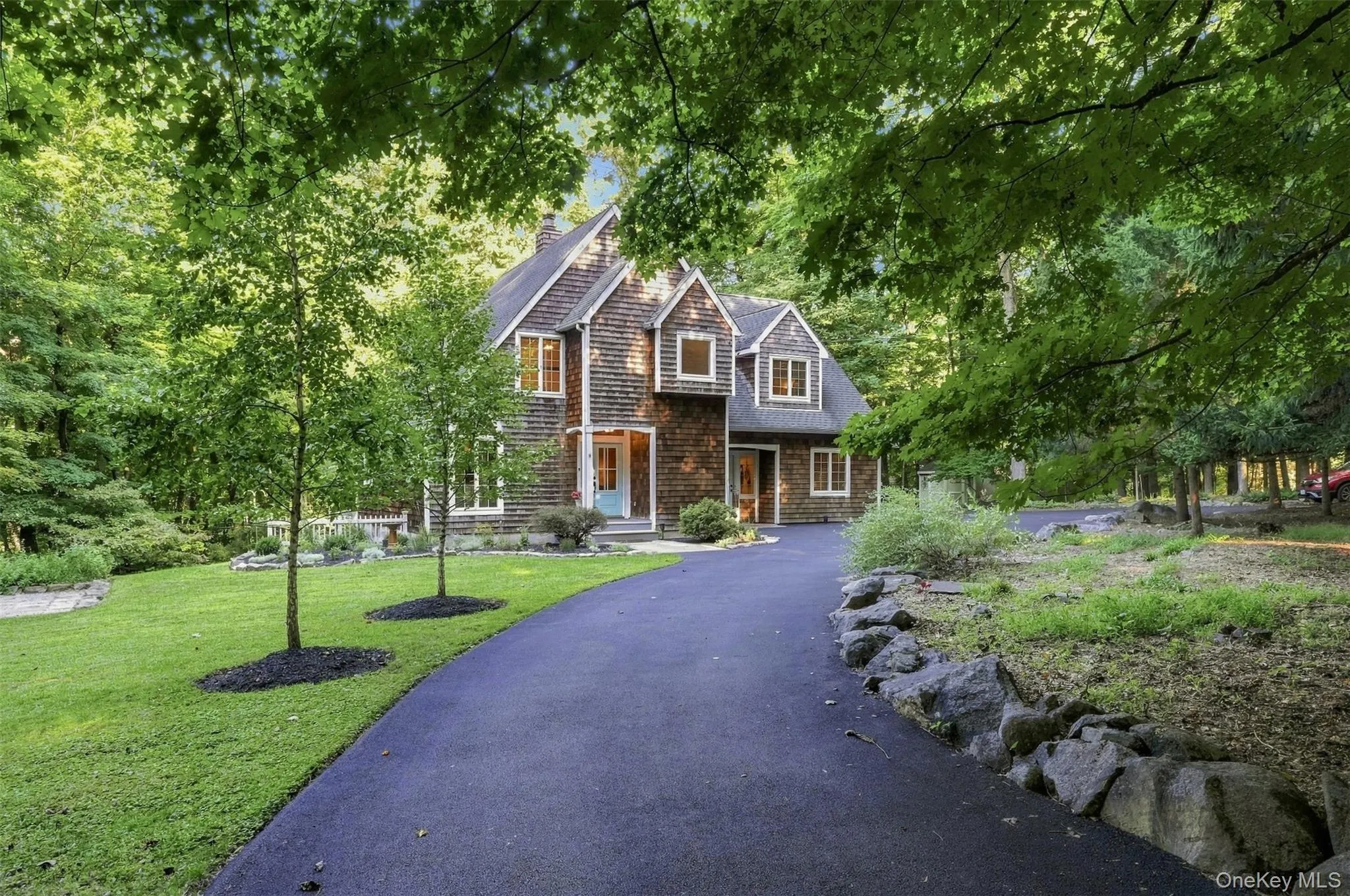 Newly paved driveway and wooded setting Newly paved driveway and wooded setting