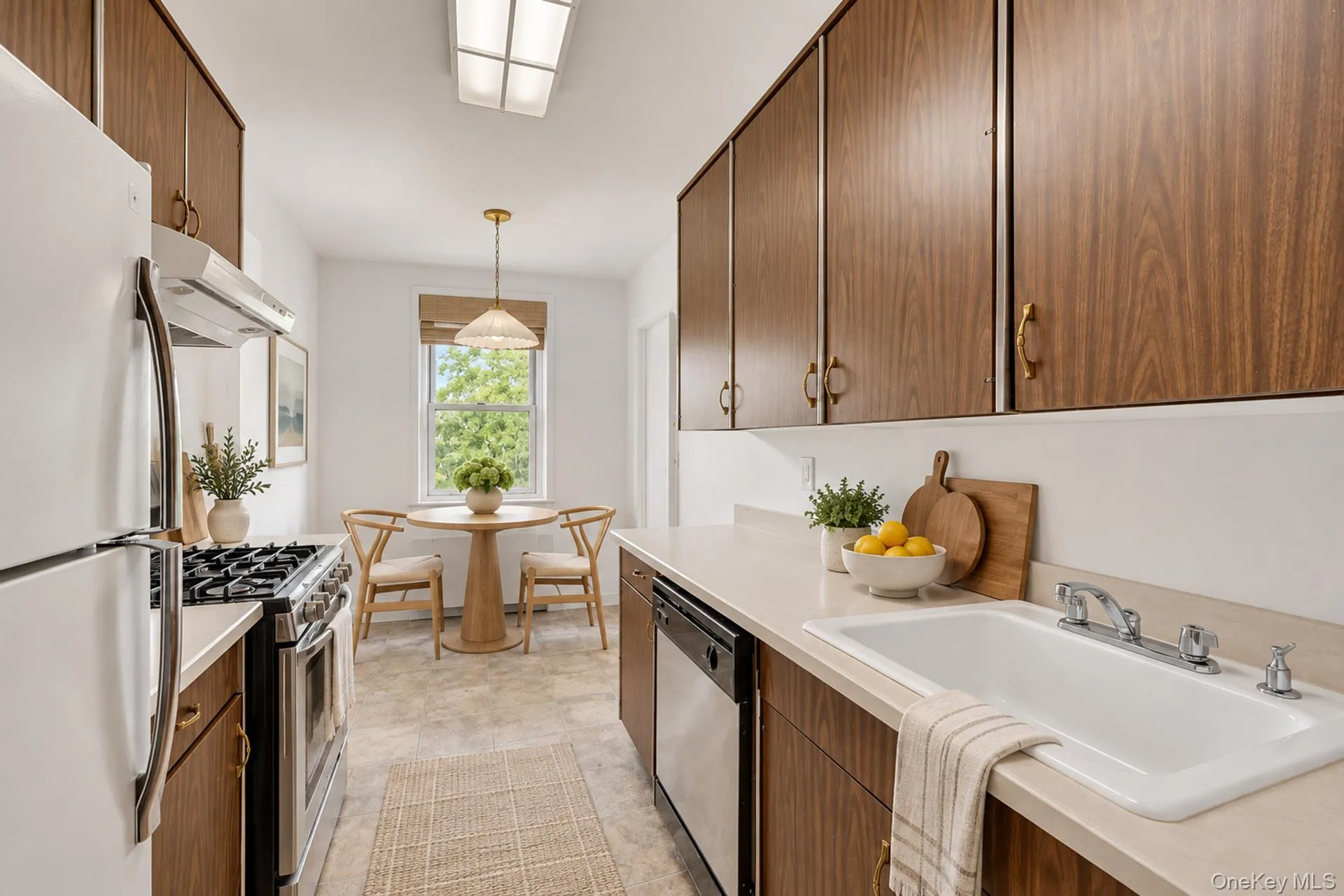 Bright, windowed eat-in kitchen with generous cabinetry and ample workspace. Some details are virtually staged. Bright, windowed eat-in kitchen with generous cabinetry and ample workspace. Some details are virtually staged.