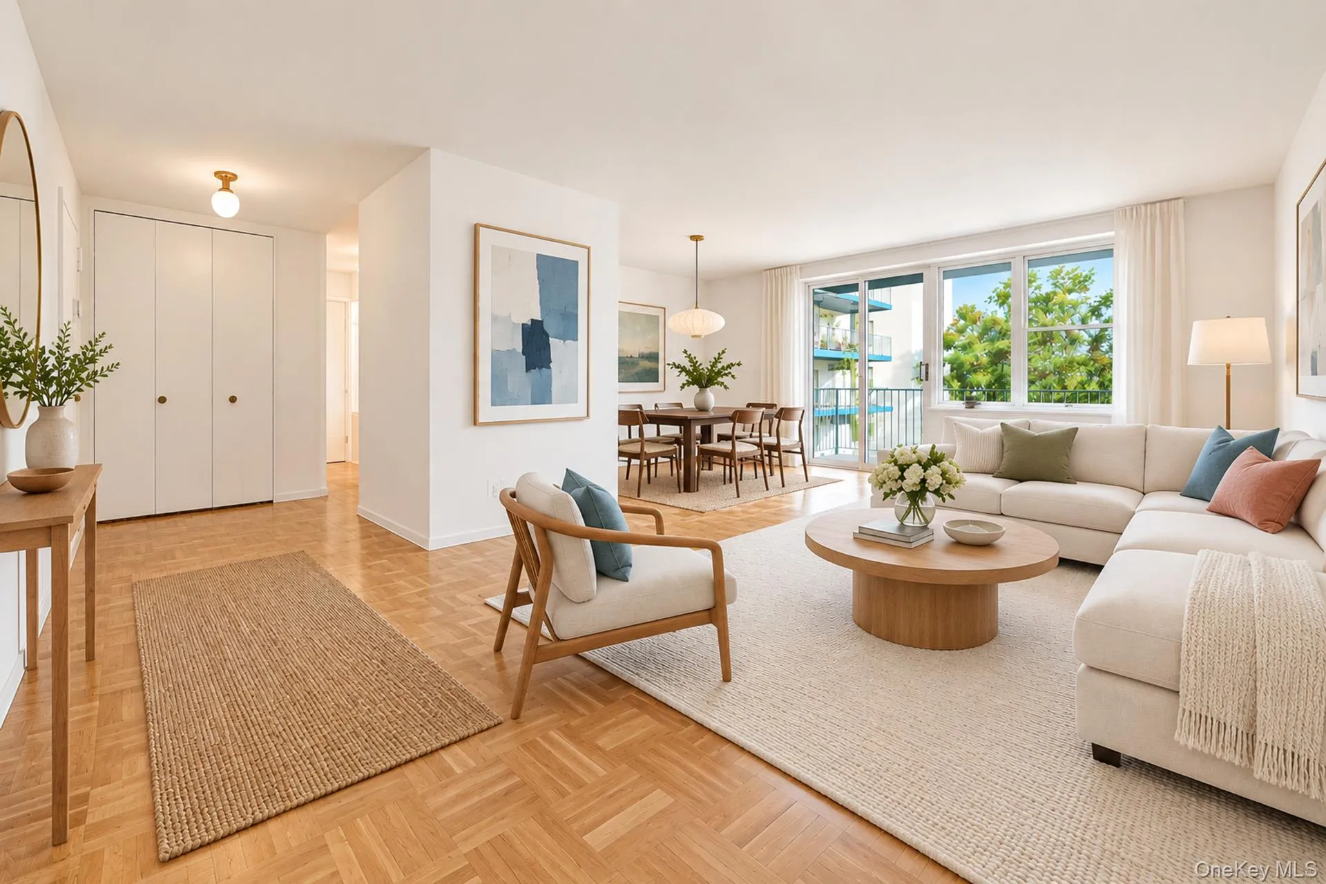 Oversized living room with a separate dining area and sliding glass doors opening to a private covered balcony. Virtually staged. Oversized living room with a separate dining area and sliding glass doors opening to a private covered balcony. Virtually staged.